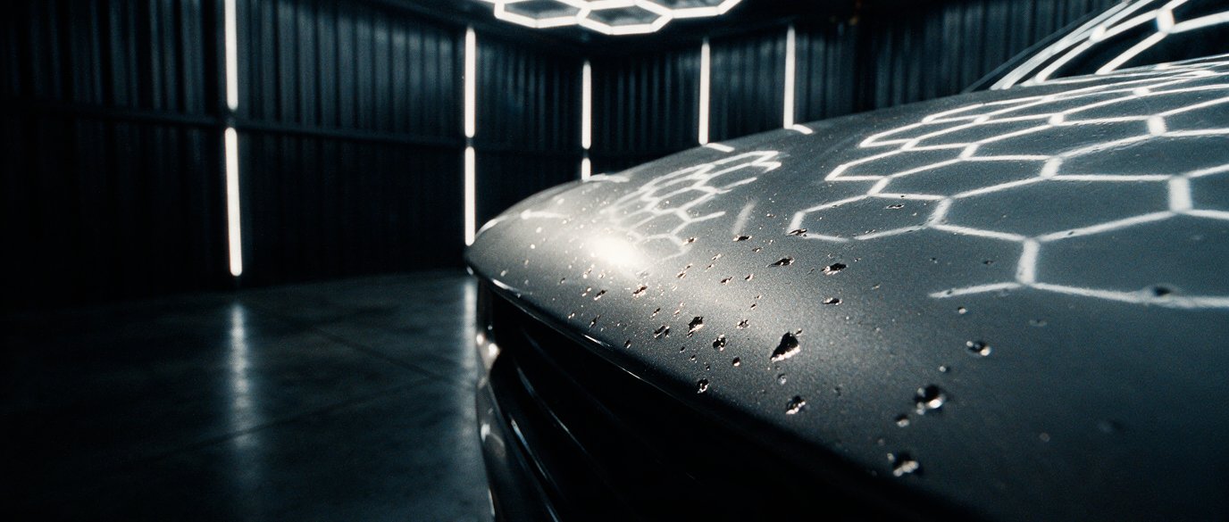 Stone chips across the leading edge of an unprotected bonnet
